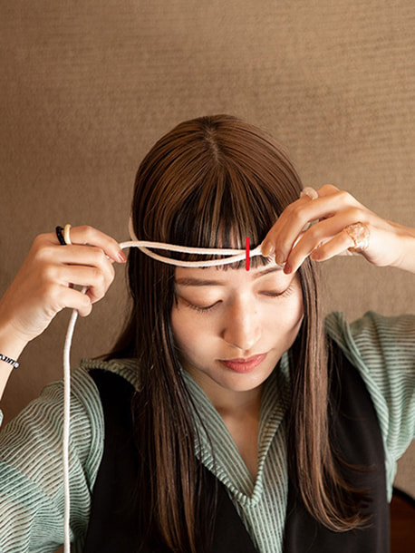 紐と定規を使って測る場合